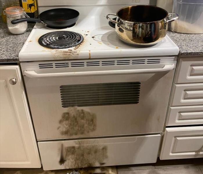 Burnt pot caused fire, smoke and soot in whole house